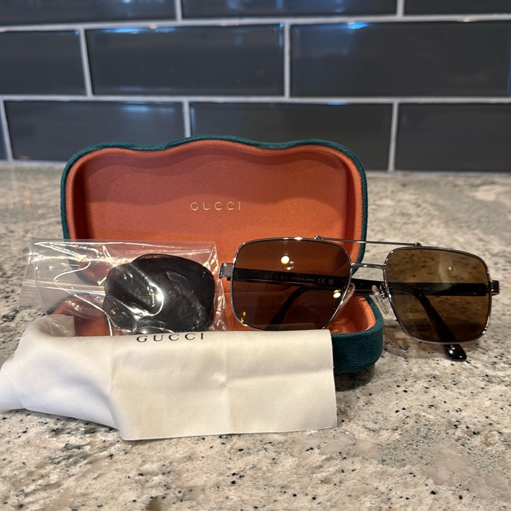 Gucci GG0529S 002 Unisex Sunglasses includes two sets of lenses